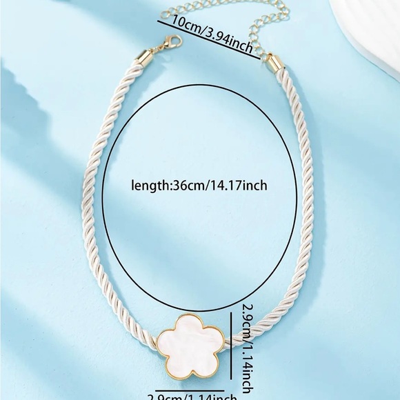 White big clover pendant on a thick twisted white rope design. - Picture 2 of 3